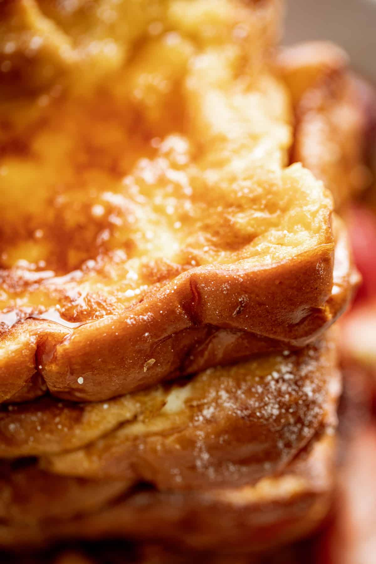 Close up of brioche with maple syrup on top. 