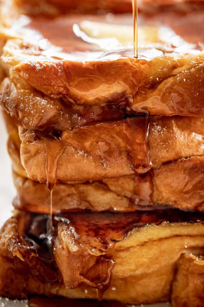 The Best French Toast is super easy to make with the perfect balance of flavours soaked into brioche slices! With a hint of vanilla and cinnamon, a touch of sweetness, and crispy pan fried edges, this is one French Toast recipe the whole family goes crazy for | cafedelites.com