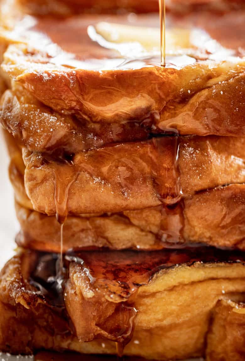 The Best French Toast is super easy to make with the perfect balance of flavours soaked into brioche slices! With a hint of vanilla and cinnamon, a touch of sweetness, and crispy pan fried edges, this is one French Toast recipe the whole family goes crazy for | cafedelites.com