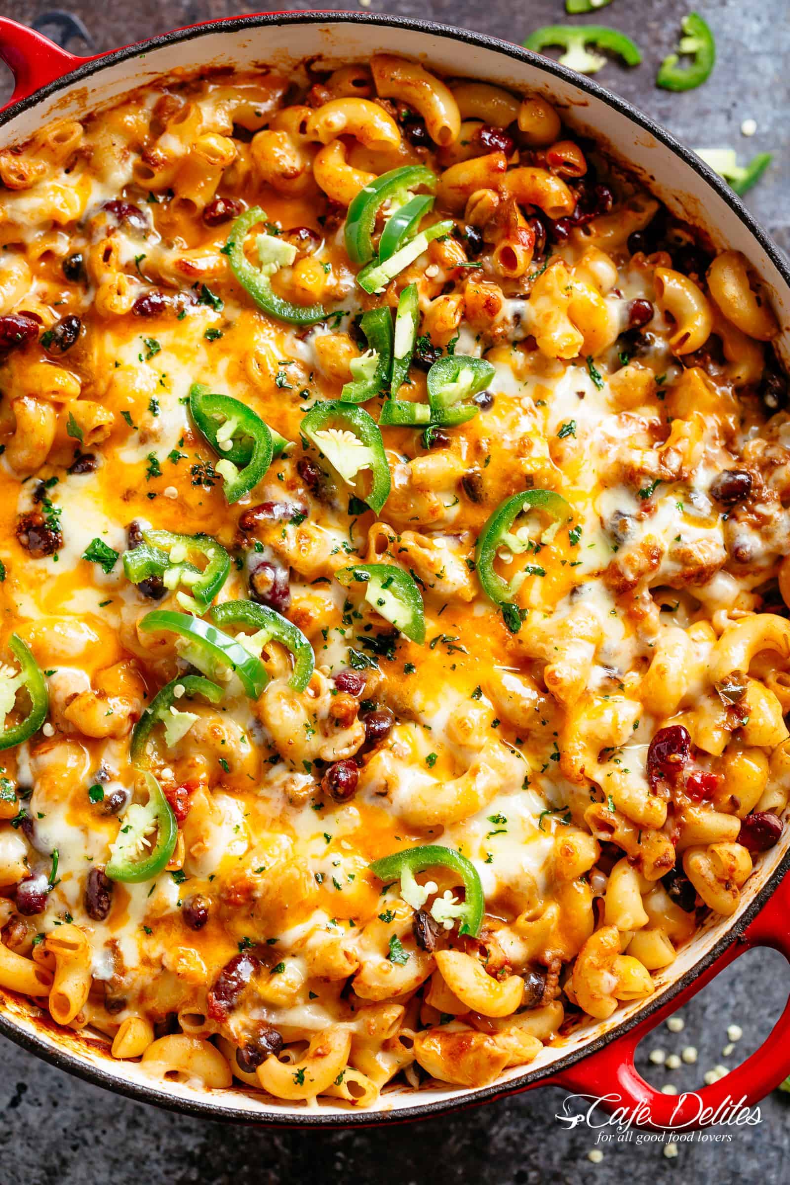 Chili Mac and Cheese with beans is the ultimate mash up of TWO favourites -- Chili PLUS Mac and Cheese! Using leftover chili OR chili made from scratch, this casserole is ready and on the table in less than 30 minutes! Incredible flavours that the whole family will go crazy for! | cafedelites.com