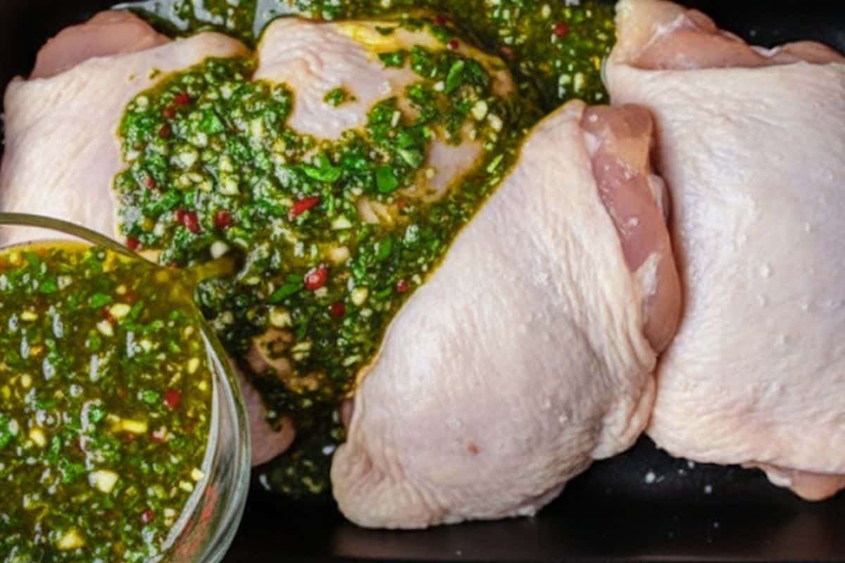 Pour 4 tablespoons of the chimichurri into a shallow dish and coat the chicken.