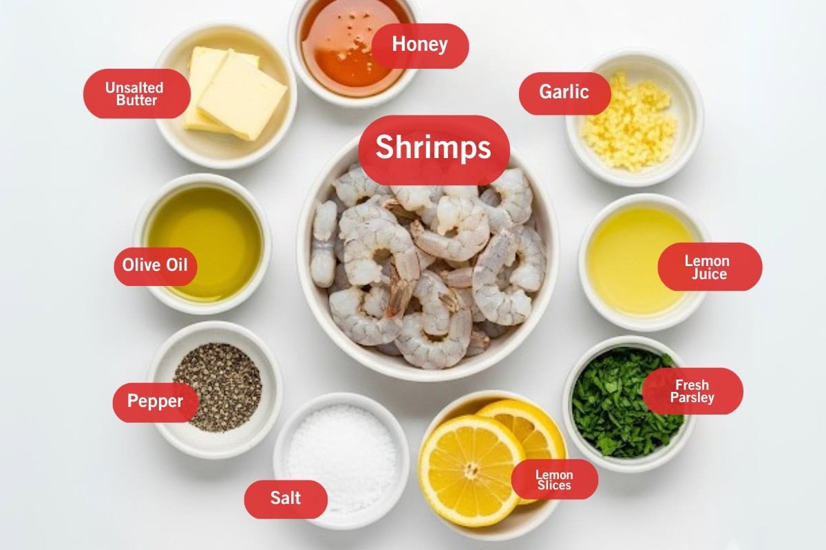 Flat lay photo of ingredient shot of unsalted butter, honey, garlic, shrimps, lemon juice, fresh parsley, lemon slices, salt, pepper, olive oil
