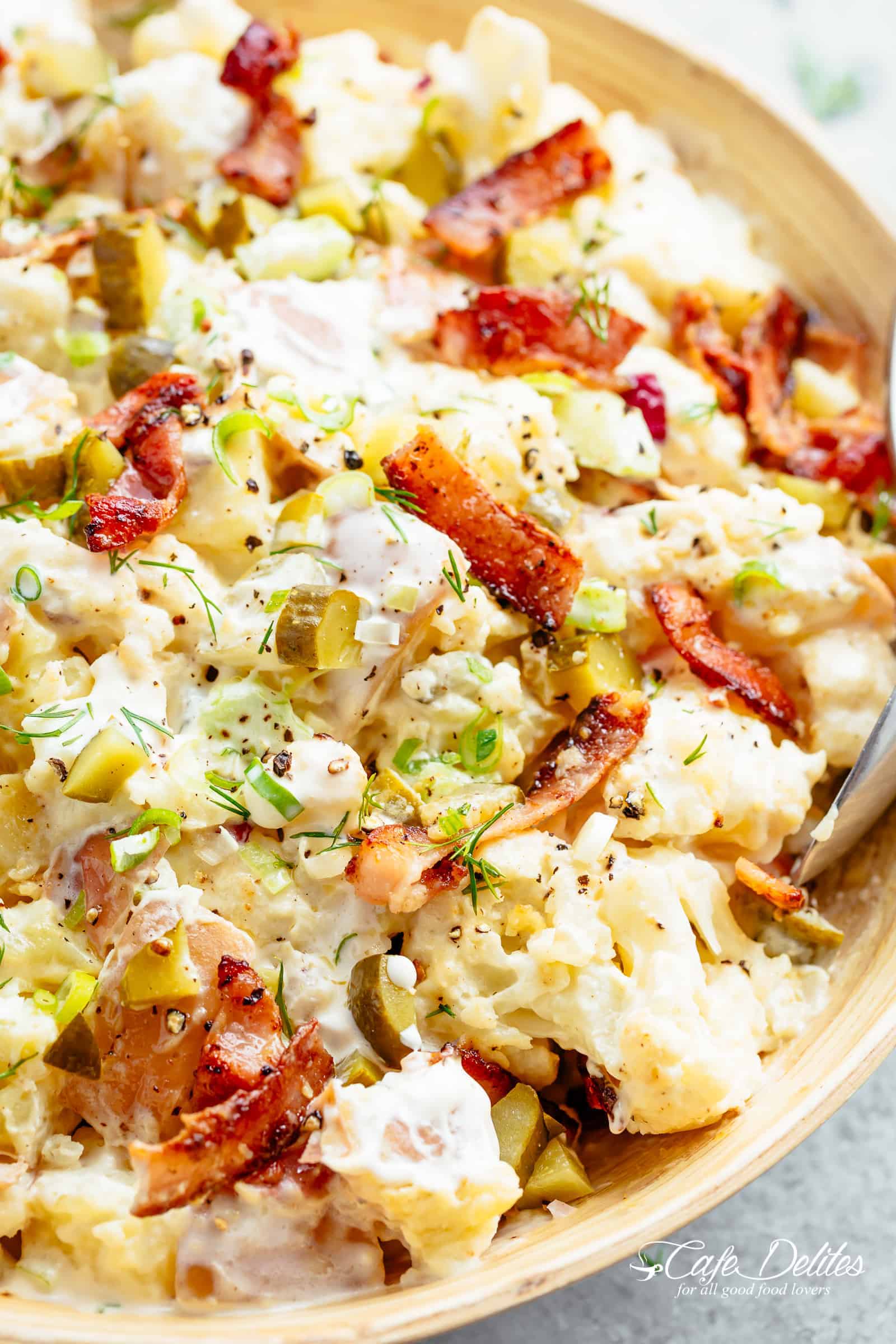 Potato Salad with Bacon, Dill Pickles, Eggs, HALF the carbs AND a creamy mayo/sour cream dressing! This Potato Salad is THE BEST side dish! HALF of the carbs of regular potato salads with SO MUCH FLAVOUR! The recipe also includes LOW CARB AND ALL CARB OPTIONS! | cafedelites.com