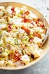 Potato Salad with Bacon, Dill Pickles, Eggs, HALF the carbs AND a creamy mayo/sour cream dressing! This Potato Salad is THE BEST side dish! HALF of the carbs of regular potato salads with SO MUCH FLAVOUR! The recipe also includes LOW CARB AND ALL CARB OPTIONS! | cafedelites.com