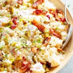 Potato Salad with Bacon, Dill Pickles, Eggs, HALF the carbs AND a creamy mayo/sour cream dressing!