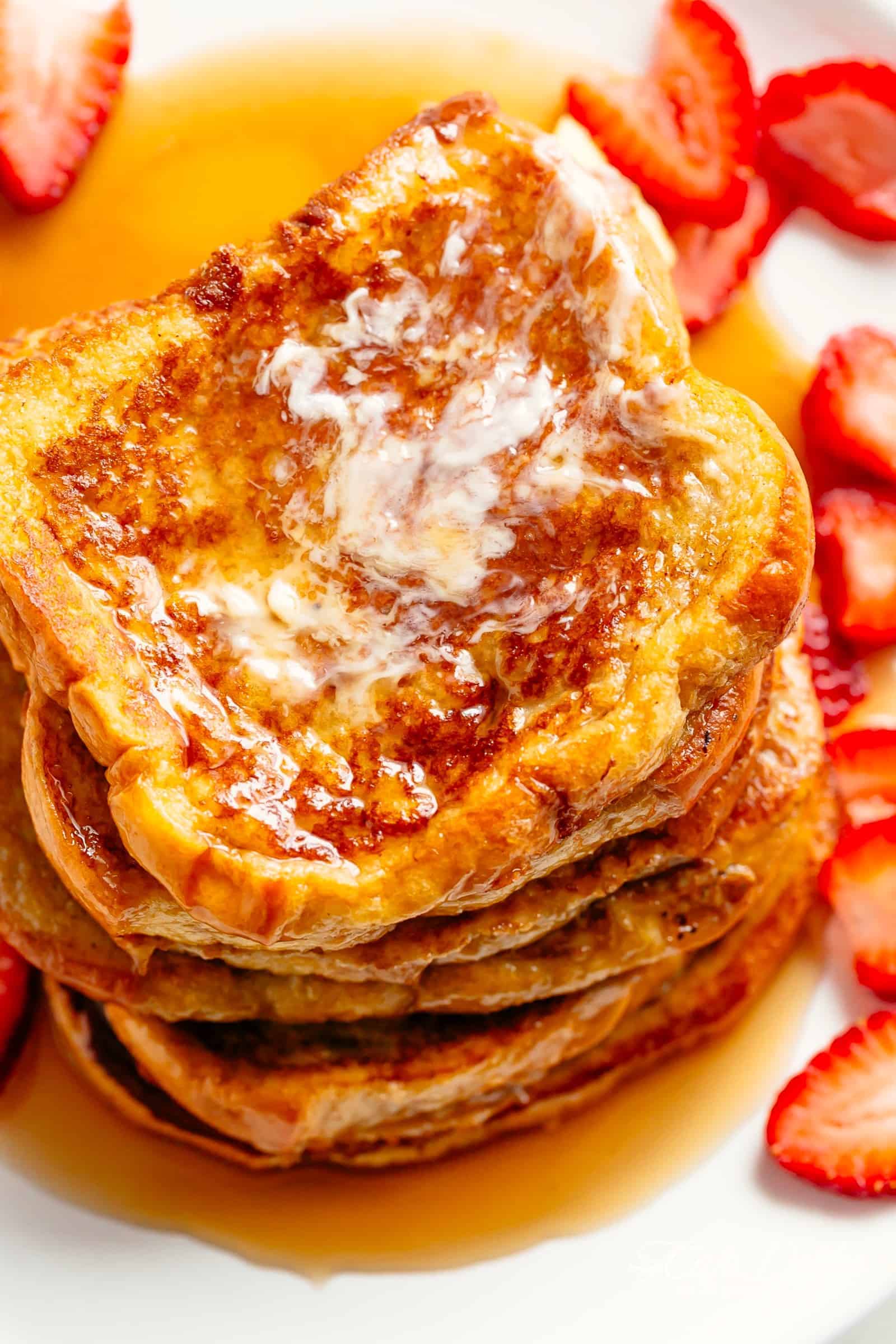The Best French Toast is super easy to make with the perfect balance of flavours soaked into brioche slices! With a hint of vanilla and cinnamon, a touch of sweetness, and crispy pan fried edges, this is one French Toast recipe the whole family goes crazy for | cafedelites.com