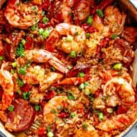 An authentic Creole Jambalaya recipe! A delicious one-pot meal coming to you from New Orleans is pure comfort food filled to the brim with chicken, shrimp, andouille sausage, rice, seasonings, spices and incredible flavours! Ready and on the table in 45 minutes!