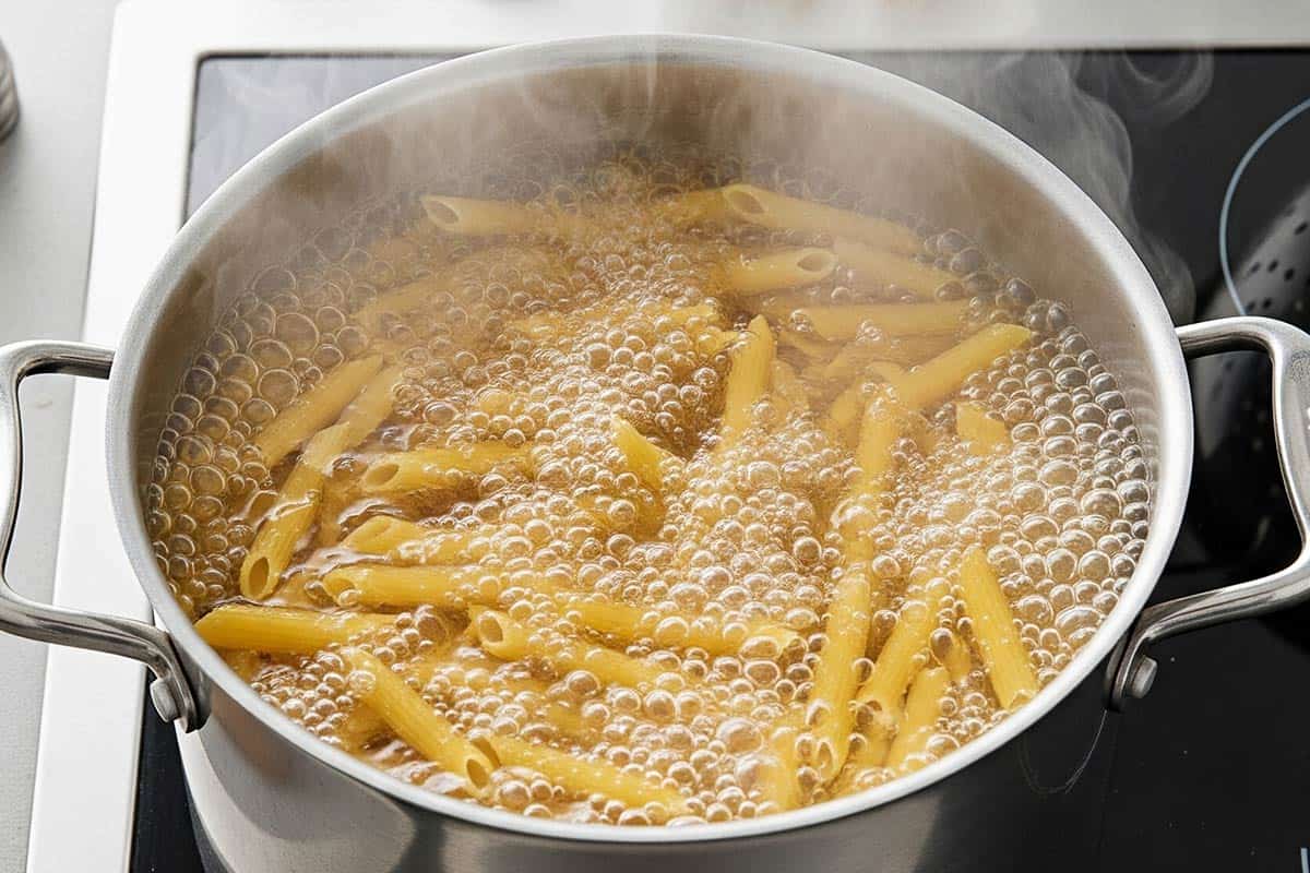 Penne in a large pot of boiling water.