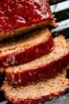 How to make the best tender and juicy Meatloaf with a delicious shiny glaze! Cheap, easy and quick to prepare, let the oven do all the work for you! The whole family goes crazy over each slice of this meatloaf recipe. PLUS... take advantage of leftovers and turn them into the best meatloaf sandwiches! | cafedelites.com