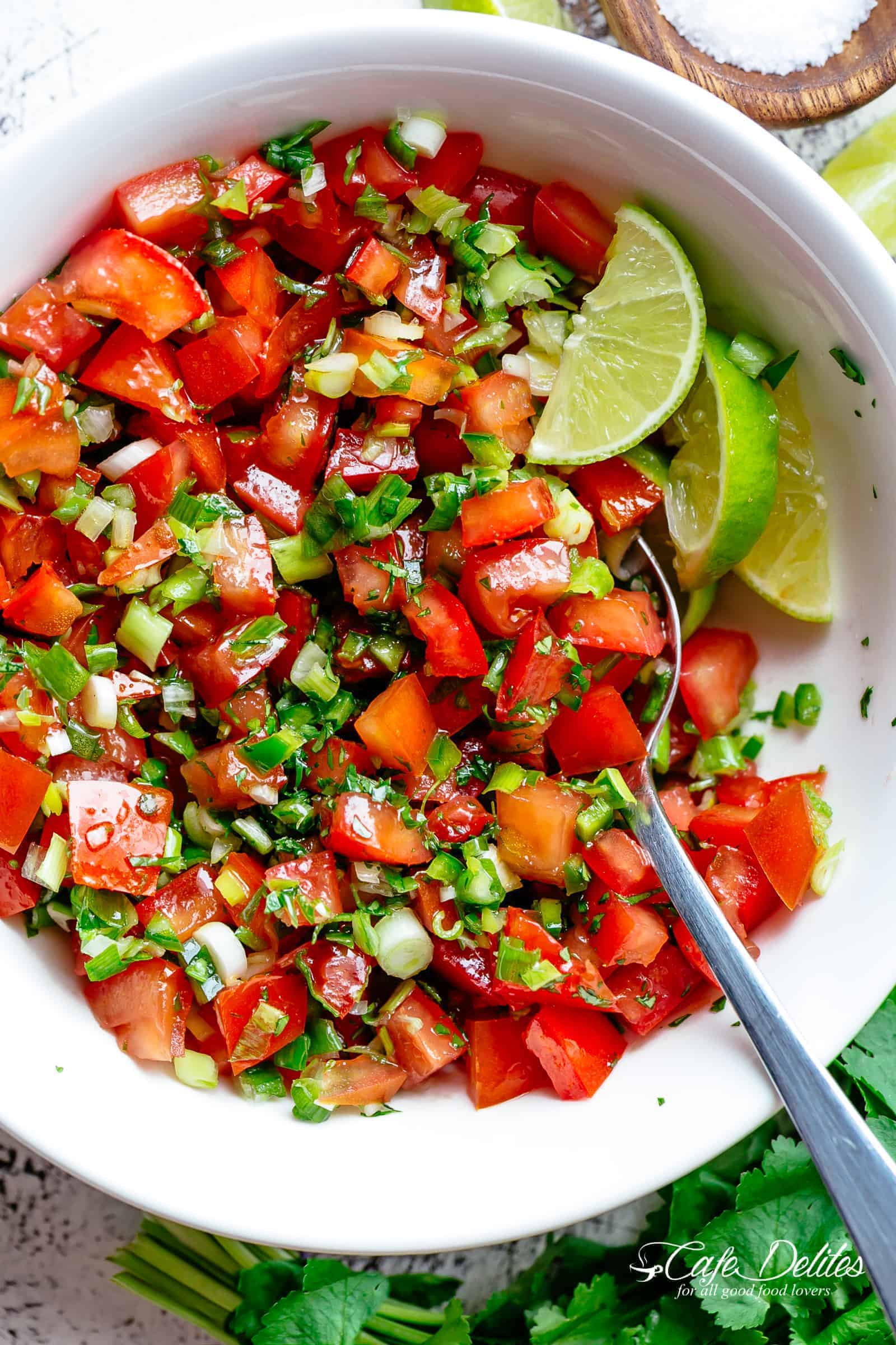Pico De Gallo is a super easy to make fresh tomato salsa you can serve with anything! From tortilla chips to tacos, enchiladas or Carne Asada! With a handful of ingredients, this Pico De Gallo is the perfect accompaniment! Also called salsa fresca or salsa cruda! | cafedelites.com