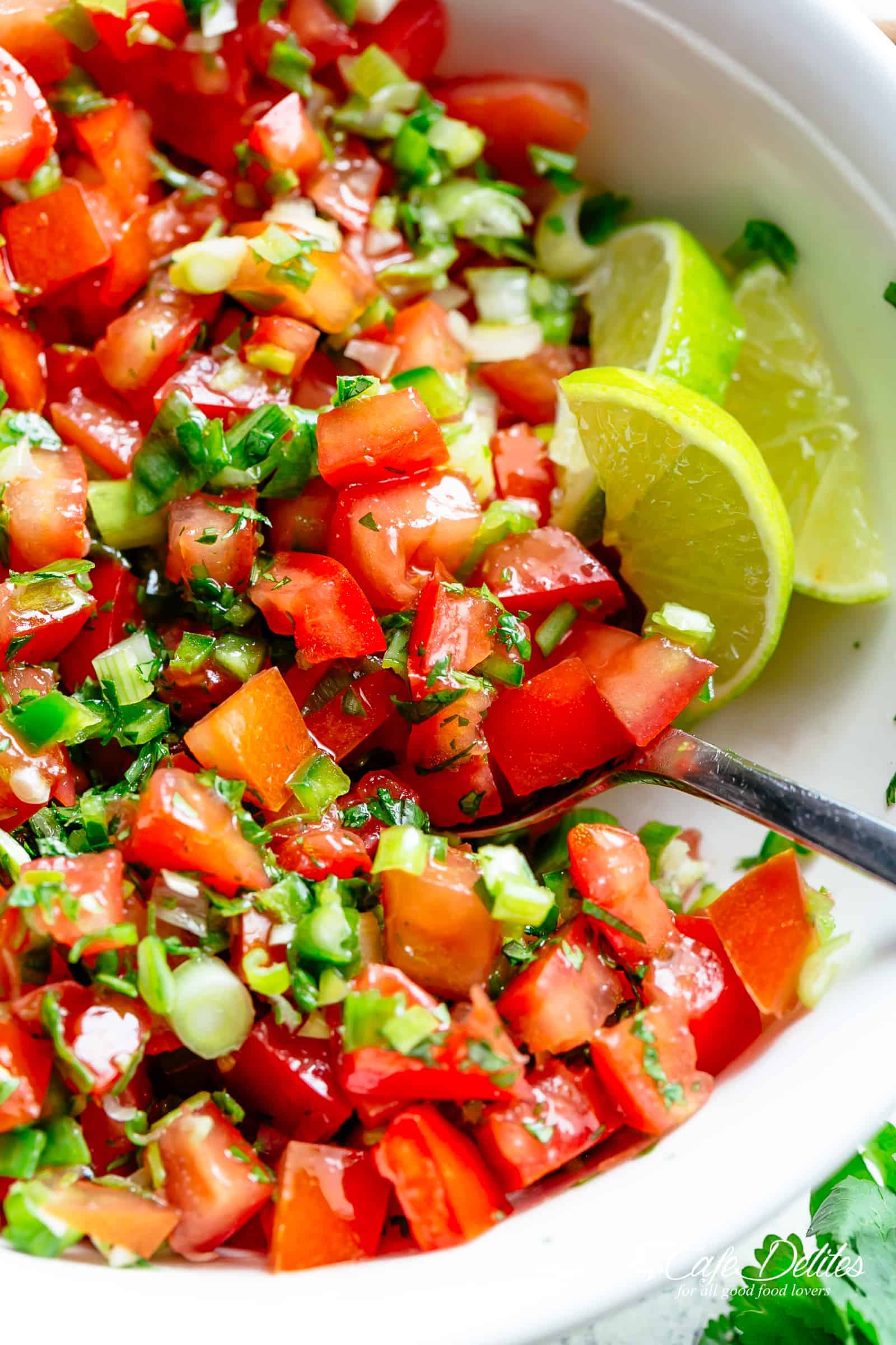 Pico De Gallo is a super easy to make fresh tomato salsa you can serve with anything! From tortilla chips to tacos, enchiladas or Carne Asada! With a handful of ingredients, this Pico De Gallo is the perfect accompaniment! Also called salsa fresca or salsa cruda! | cafedelites.com