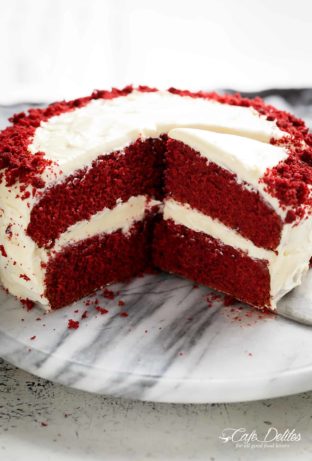 The most incredible Red Velvet Cake with Cream Cheese Frosting is fluffy, soft, buttery and moist with the most perfect velvet texture! Super easy to make with a few tips and tricks for the best results! You will go crazy for a second slice!