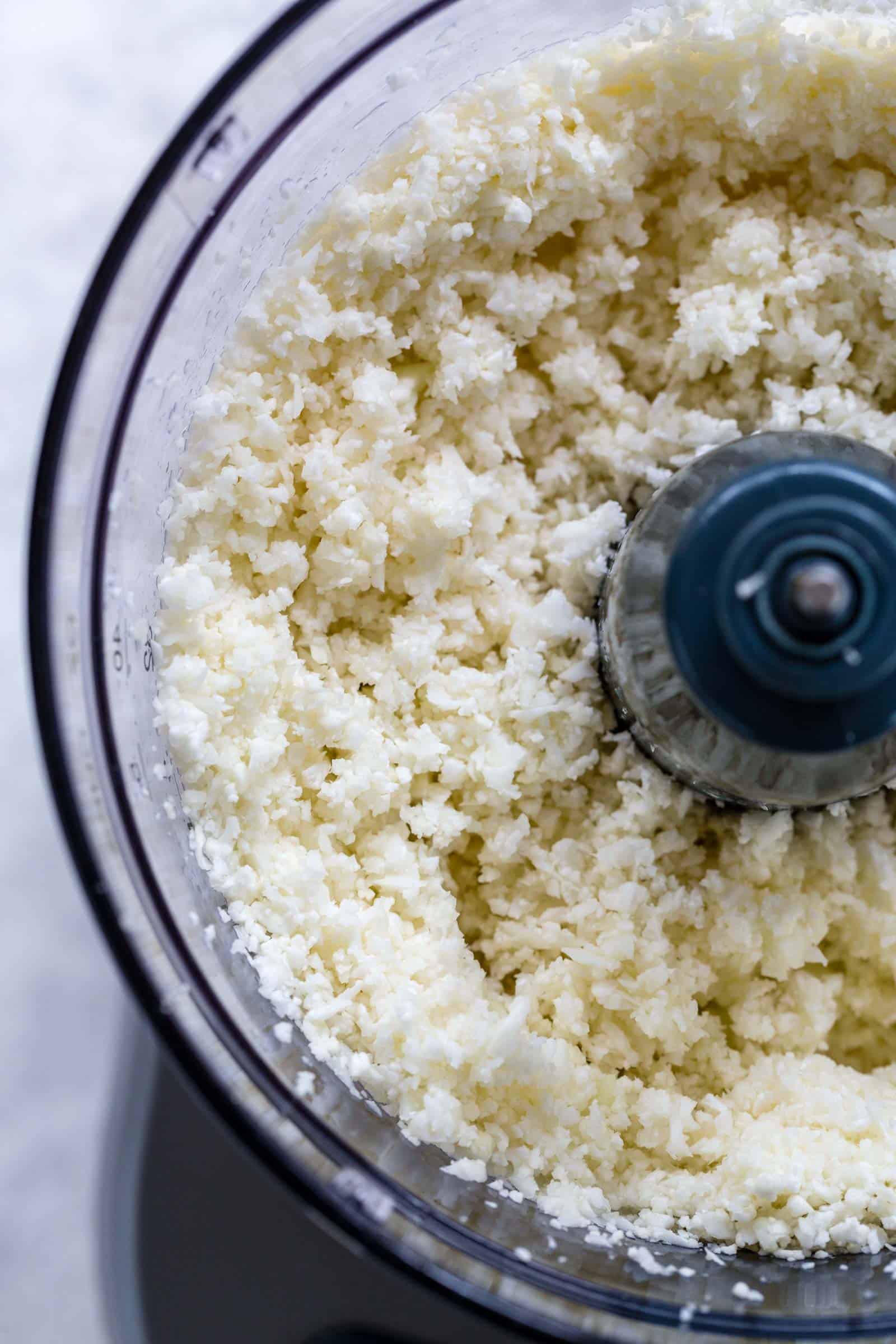 cauliflower rice being made in a food processor