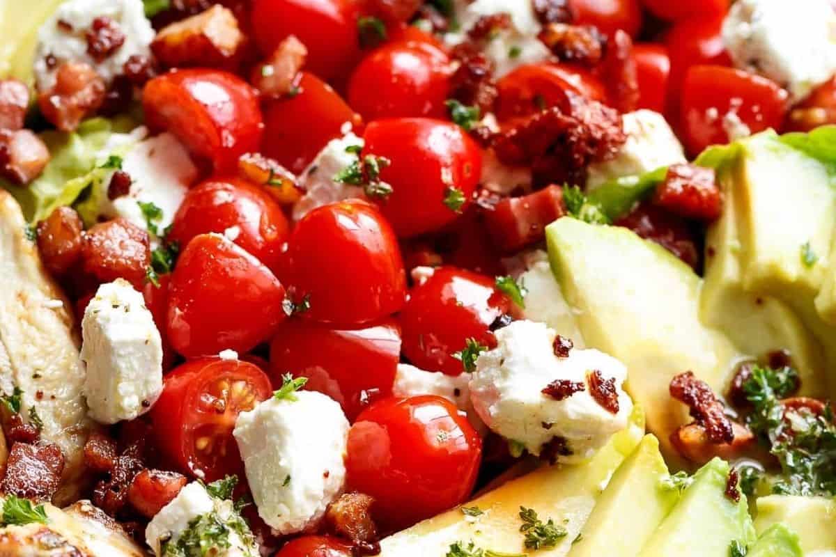 Arrange the sliced chicken over the salad, drizzle with the reserved dressing, and finish with lemon wedges. - 8