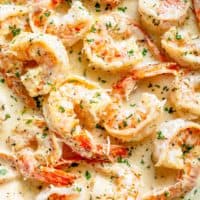 Creamy Garlic Shrimp With Parmesan is a deliciously easy Shrimp Recipe! Coated in a rustic and buttery sauce ready in less than 10 minutes, people will think there is a hidden chef in your kitchen! Transform ingredients you most likely already have in your refrigerator into an incredible dinner! | cafedelites.com