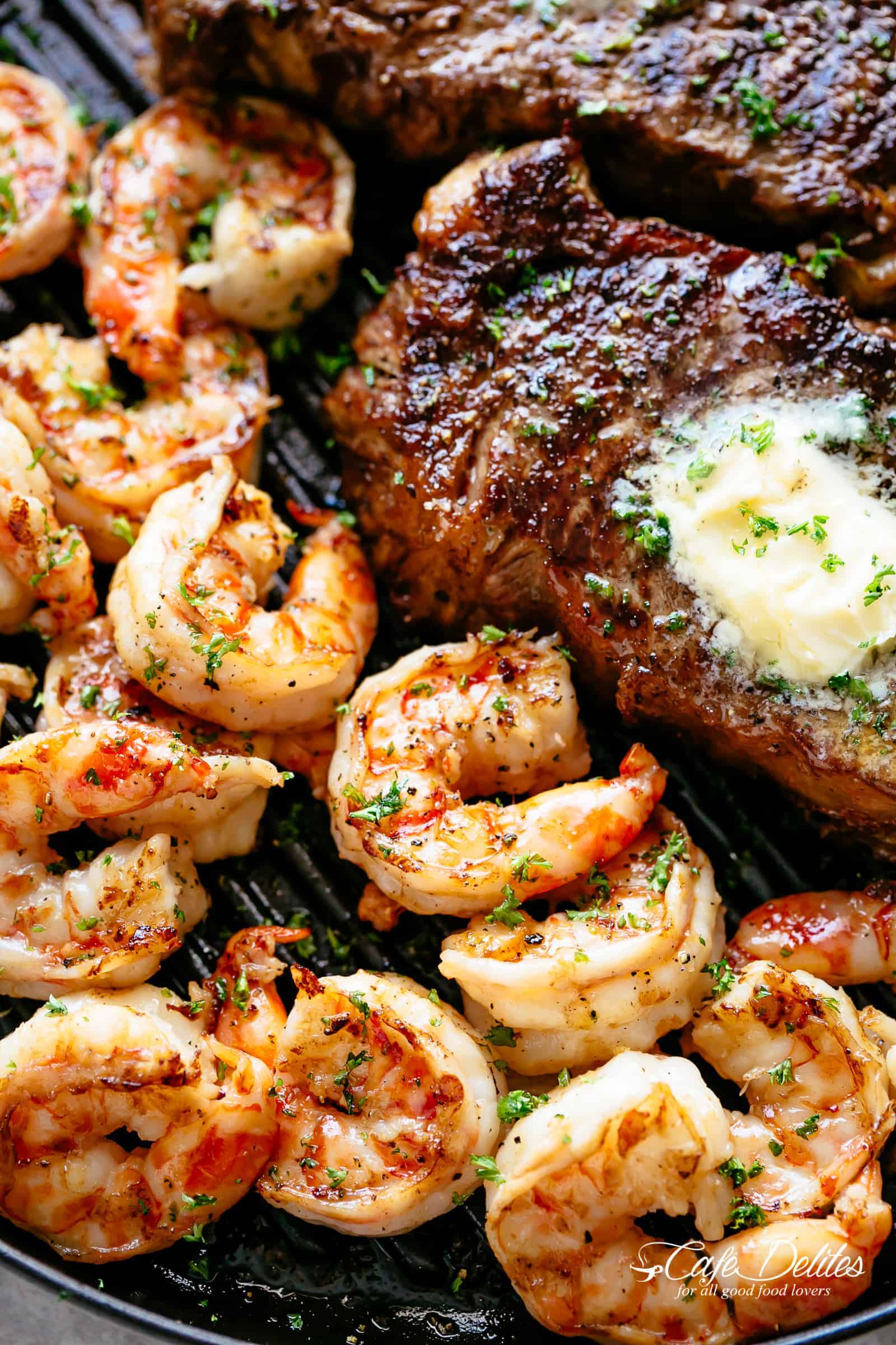 Grilled Steak & Shrimp slathered in garlic butter | cafedelites.com