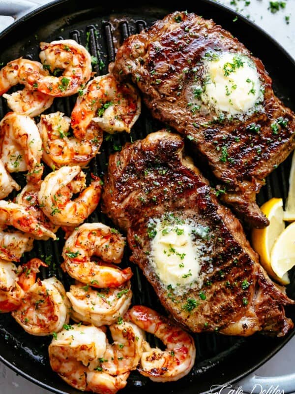 Top view of Grilled Steak & Shrimp slathered in garlic butter.