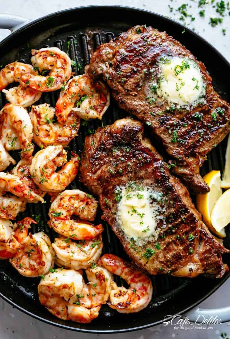 Grilled Steak & Shrimp slathered in garlic butter makes for the BEST steak recipe! A gourmet steak dinner that tastes like something out of a restaurant, ready and on the table in less than 15 minutes | cafedelites.com