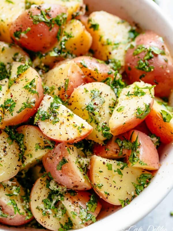 Garlicky Herb Red Potato Salad is ridiculously easy to make and packed with flavor! Slathered in the best and most delicious herb dressing with olive oil, a slight tang of vinegar, a kick of garlic and the most incredible flavours of fresh herbs, this Potato Salad Recipe will be a hit on your dinner table!