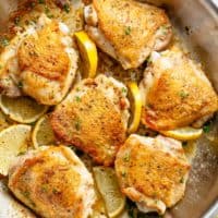 Roast Lemon Chicken thighs with crispy skin pan, seared then oven baked for tender and juicy chicken full of flavour! Your new favourite chicken recipe is here! With a kick of garlic and a touch of herbs, simple to make with minimal ingredients and maximum flavour! | cafedelites.com