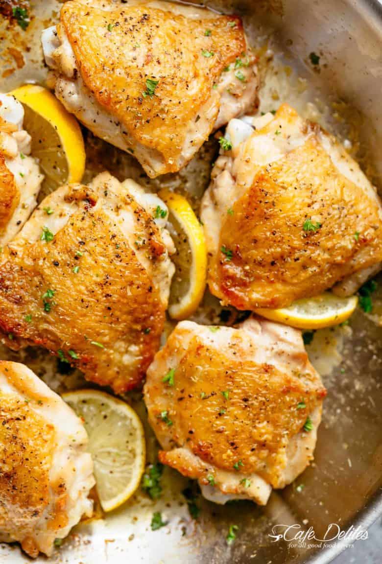 Roast Lemon Chicken thighs with crispy skin pan, seared then oven baked for tender and juicy chicken full of flavour! Your new favourite chicken recipe is here! With a kick of garlic and a touch of herbs, simple to make with minimal ingredients and maximum flavour! | cafedelites.com