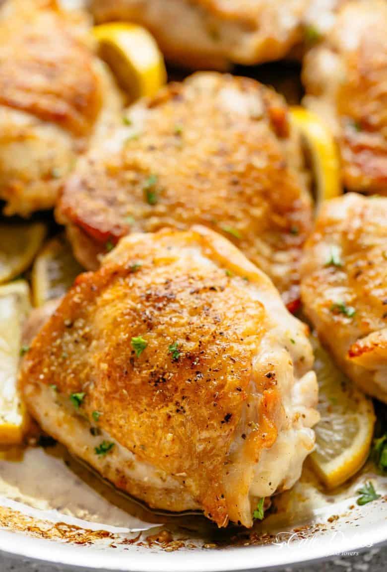 Roast Lemon Chicken thighs with crispy skin pan, seared then oven baked for tender and juicy chicken full of flavour! Your new favourite chicken recipe is here! With a kick of garlic and a touch of herbs, simple to make with minimal ingredients and maximum flavour! | cafedelites.com