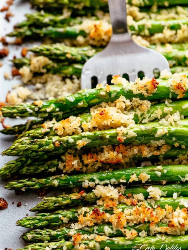 Garlic Butter Asparagus with Crispy Parmesan with silver fork