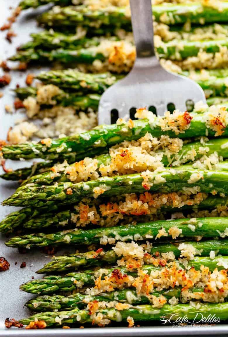 Garlic Butter Asparagus with Crispy Parmesan has so much flavour! The perfect crispy and crunchy side dish OR snack! Topped with a buttery Panko crumb mixture with parmesan cheese and garlic, then roasted and broiled (or grilled) until deliciously crispy with SO MUCH FLAVOUR. Even the pickiest of eaters will LOVE this Asparagus recipe! | cafedelites.com