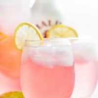 Pink Vodka Lemonade with a splash of Malibu and lime juice to get your party started! Easy to make and refreshing! | cafedelites.com