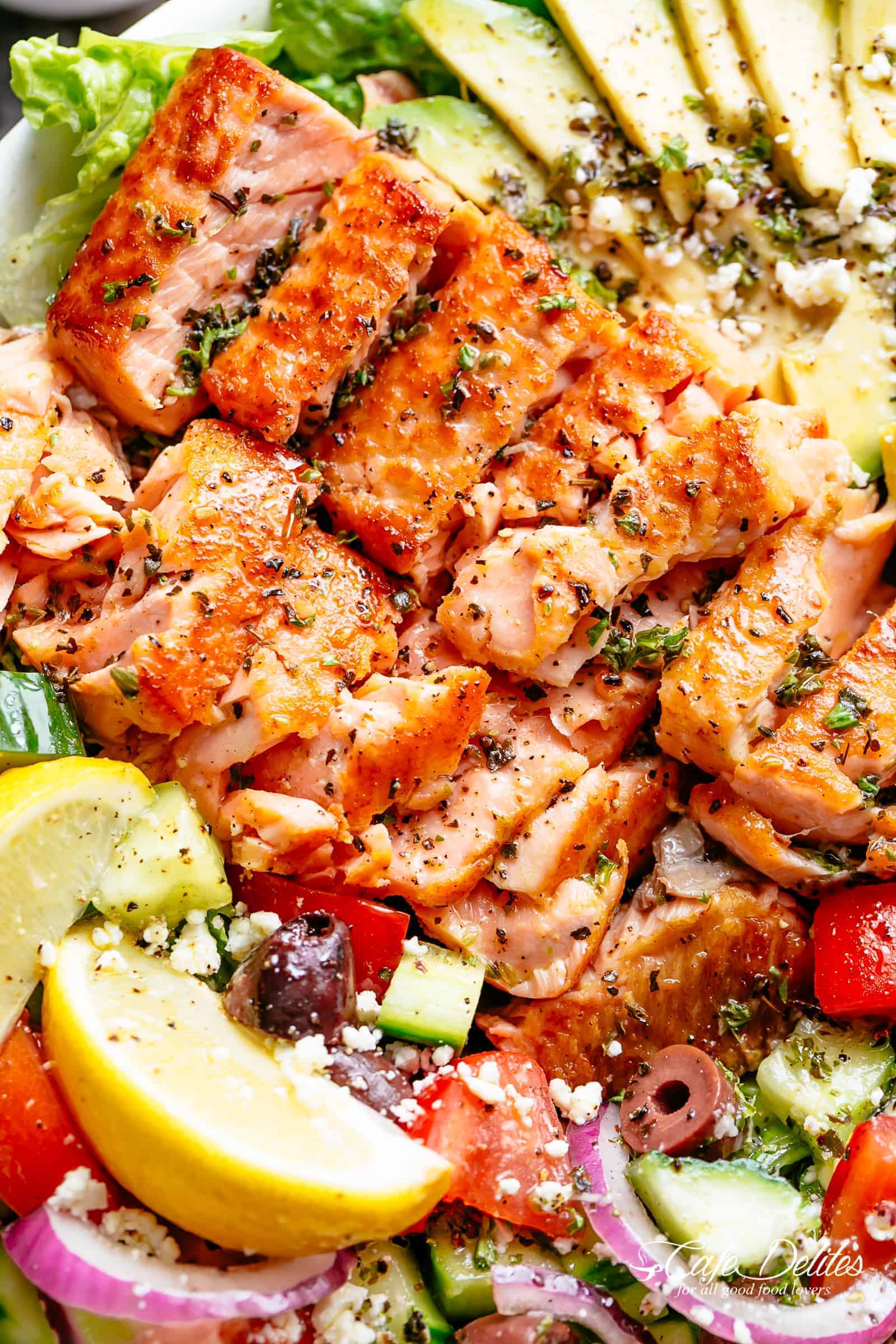 Avocado Salmon Salad with an incredible lemon herb Mediterranean dressing! Loaded with cucumber, olives, tomatoes and feta cheese! | cafedelites.com