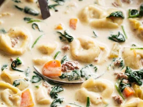 Slow Cooker Creamy Tortellini Soup is pure comfort food, loaded with vegetables, Italian sausage and cheese tortellini! NO flour and NO heavy cream! | https://cafedelites.com