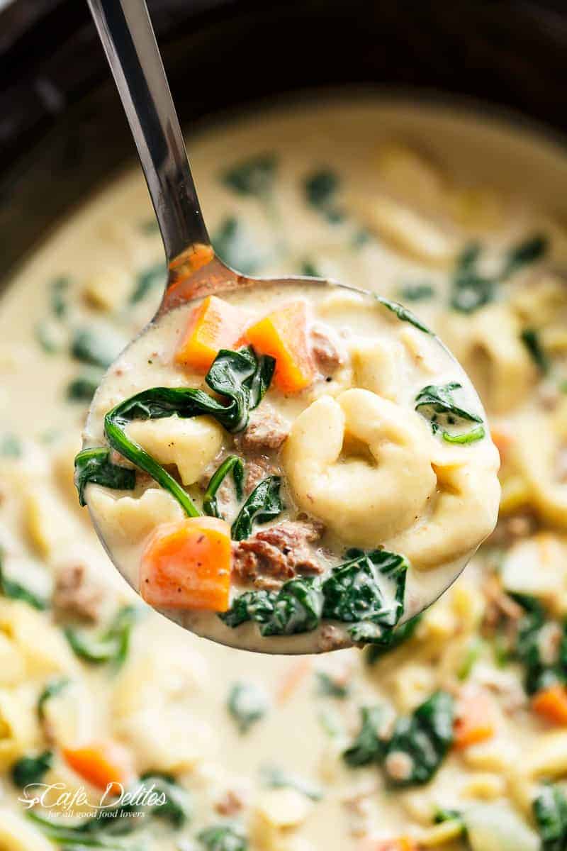 Pasta soup is pure comfort food, loaded with vegetables, Italian sausage and cheese tortellini! NO flour and NO heavy cream! | https://cafedelites.com