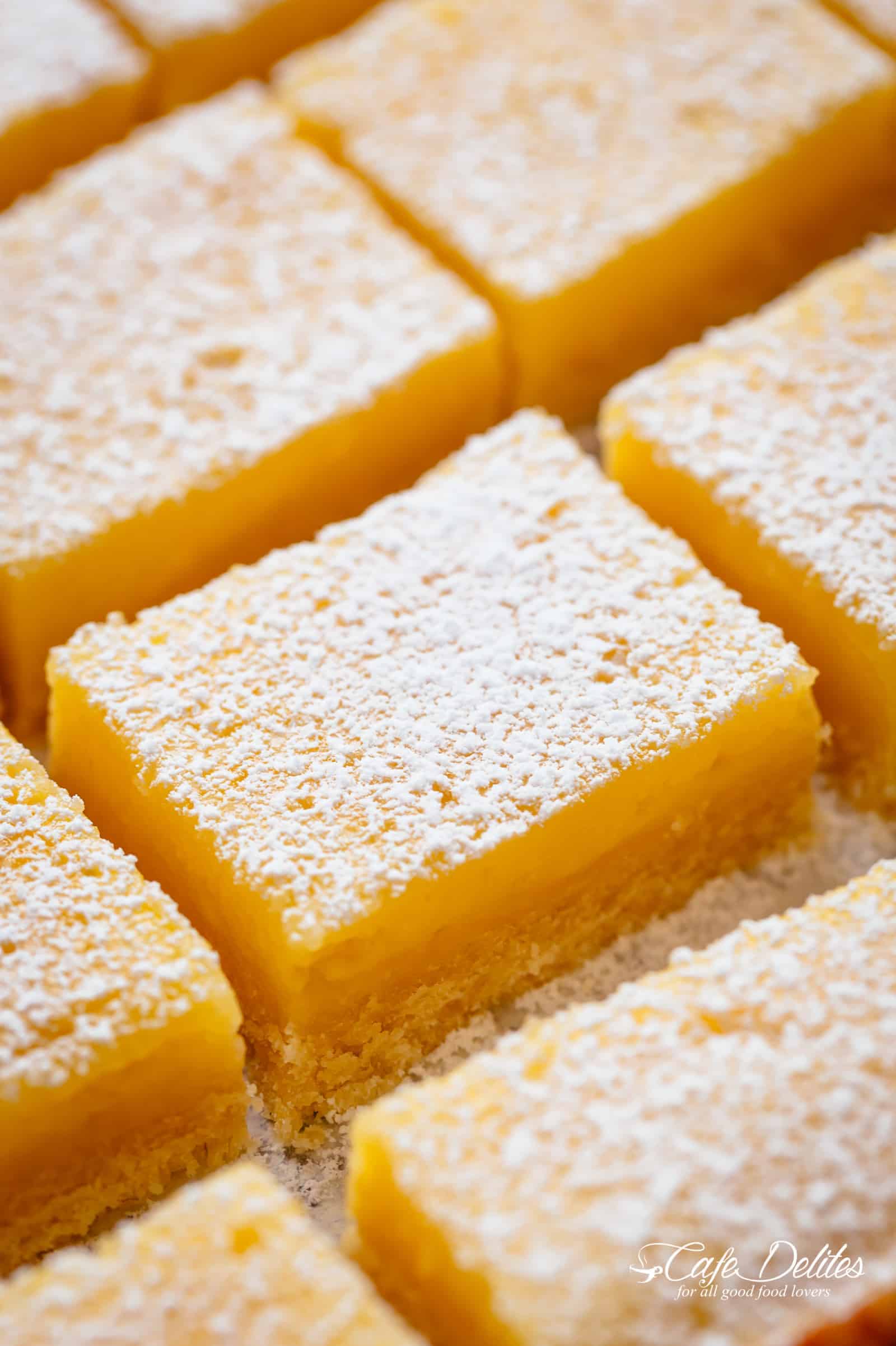 101 calorie Lightened Up Lemon Bars are the perfect dessert and taste so sinful without the guilt! You won't believe they're lightened up! | https://cafedelites.com