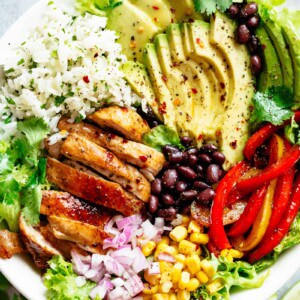 Fajita Chicken Burrito Bowl is packed with juicy golden chicken, cilantro lime rice, avocado and a delicious dressing