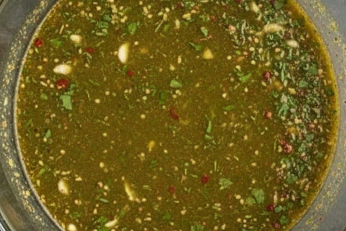 Whisk olive oil, lime juice, cilantro, garlic, brown sugar, chili flakes, cumin, and salt until well combined.