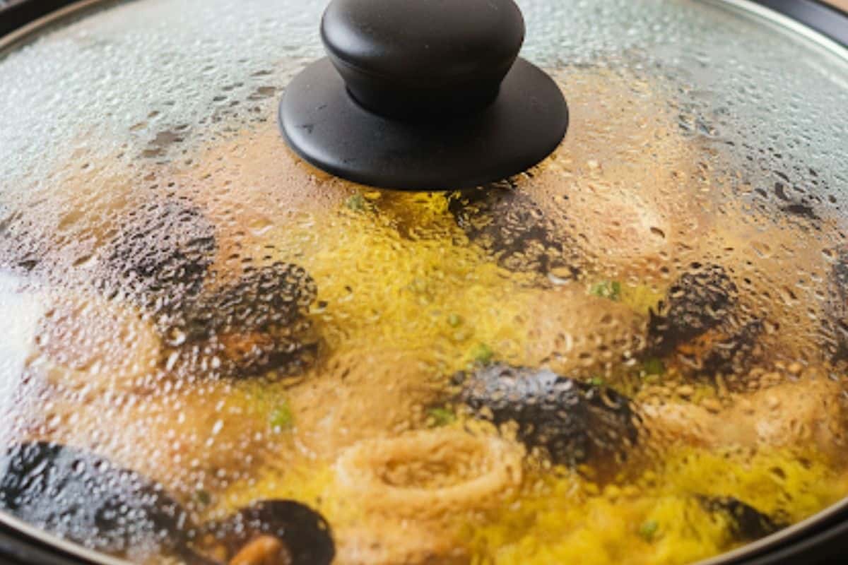 Bring the mixture to a gentle boil. Reduce the heat and cover.
