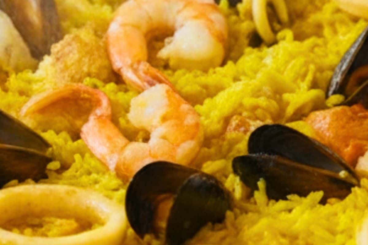 :Once the rice is nearly cooked, gently fold in the shrimp.