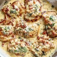 Crispy seared Chicken Thighs in a smooth and creamy garlic Dijon sauce with Bacon pieces and Spinach