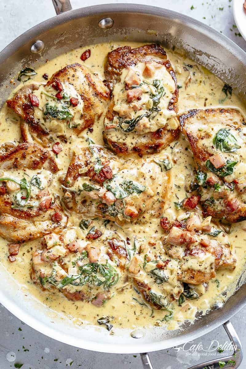 Crispy seared Chicken Thighs in a smooth and creamy garlic Dijon sauce with Bacon pieces and Spinach! SO EASY and deliciously low carb! | cafedelites.com