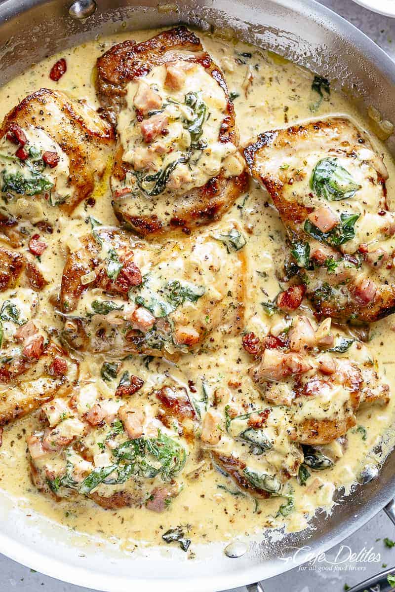 Crispy seared Chicken Thighs in a smooth and creamy garlic Dijon sauce with Bacon pieces and Spinach! SO EASY and deliciously low carb! | cafedelites.com
