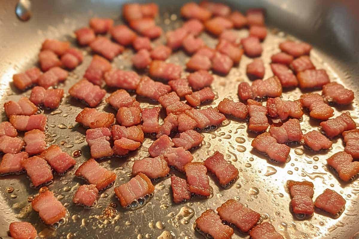 Cooking the bacon In a large skillet.