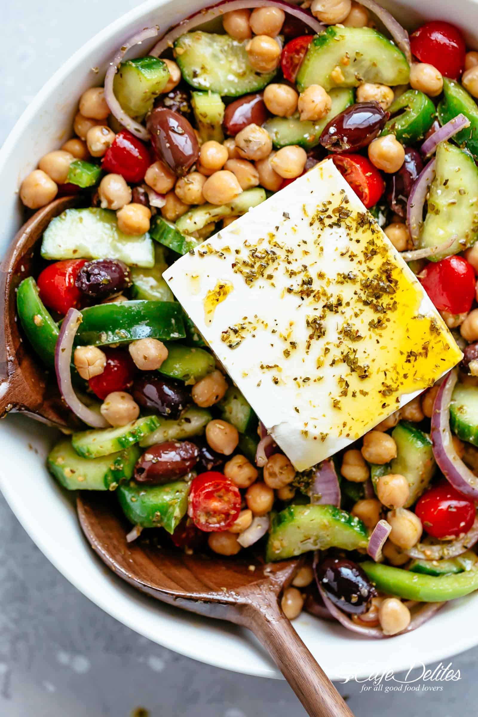 Greek Chickpea Salad with an authentic greek salad dressing is a favourite salad to serve as a main OR as a side! Healthy and filling! | cafedelites.com