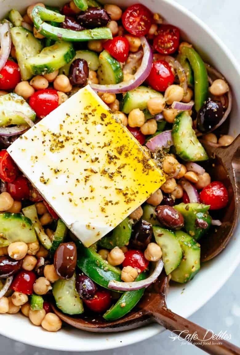 Greek Chickpea Salad with an authentic greek salad dressing is a favourite salad to serve as a main OR as a side! Healthy and filling! | cafedelites.com
