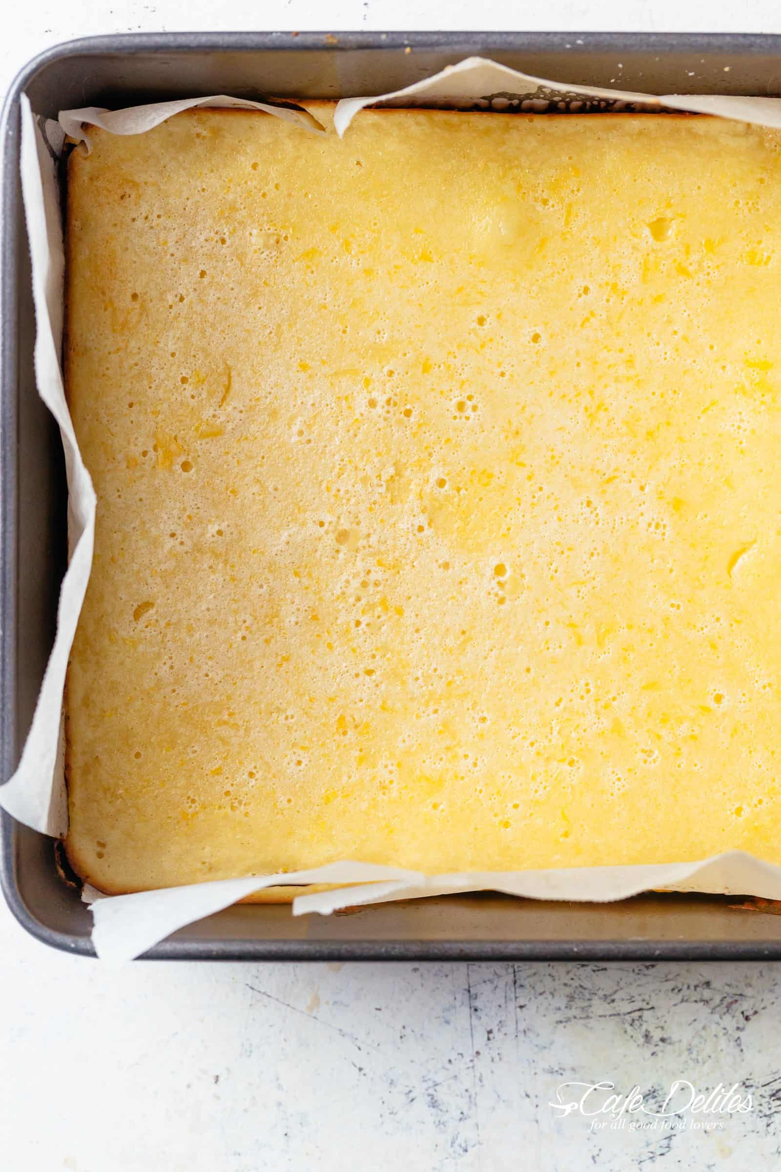 101 calorie Lightened Up Lemon Bars are the perfect dessert and taste so sinful without the guilt! You won't believe they're lightened up! | https://cafedelites.com