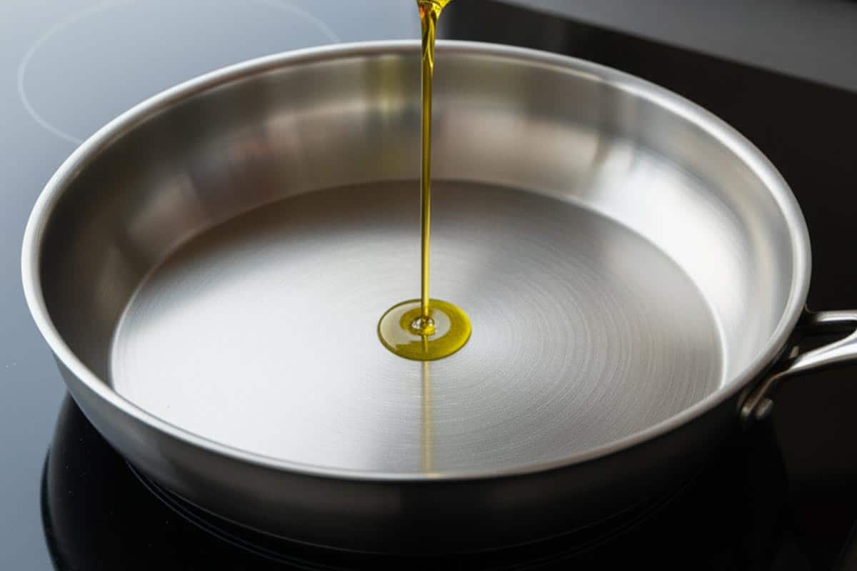 Pouring oil on the pan.