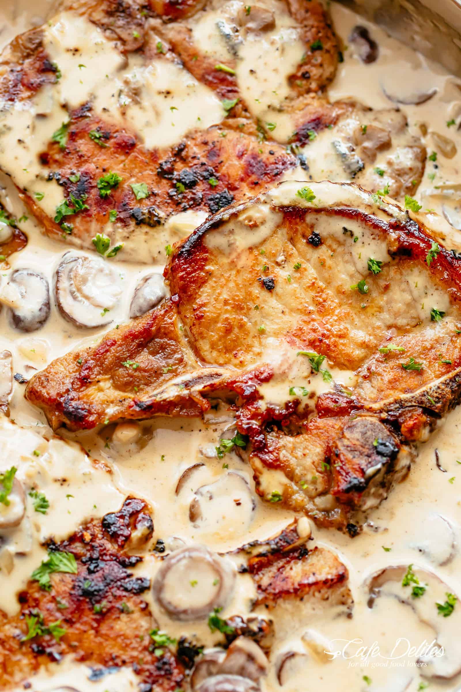 Seared Pork Chops with a creamy garlic mushroom sauce is a super easy dinner recipe! | cafedelites.com
