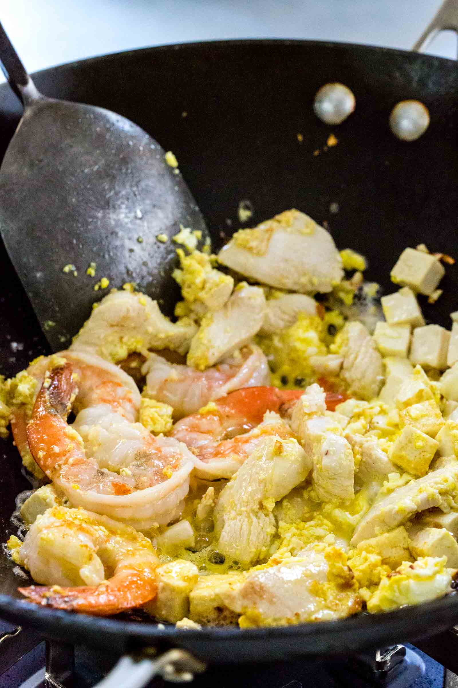 fried rice noodles combined with a mixture of juicy chicken and succulent shrimp in a deli Pad Thai