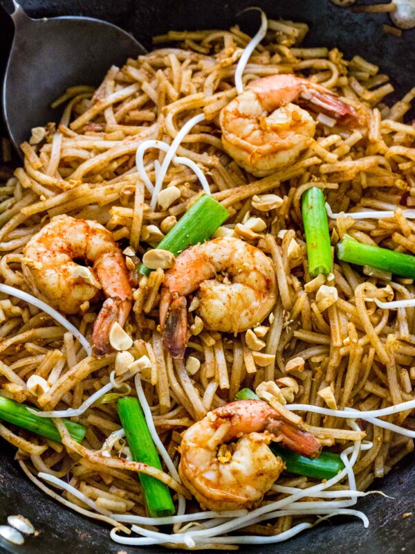 pad thai cooking in a wok in a pan
