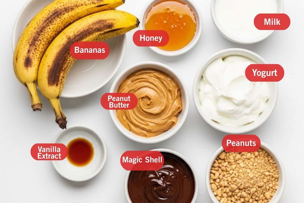 Flat lay of ingredient shot of bananas, honey, milk, yogurt, peanut butter, vanilla extract, magic shell and peanuts