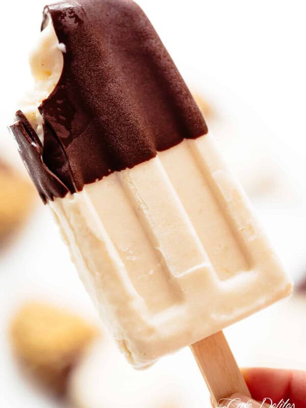 A bite taken from Chocolate-Covered-Banana-Popsicles